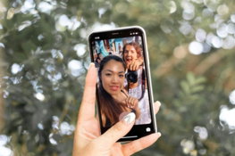 woman-holding-black-android-smartphone.jpg woman holding black android smartphone